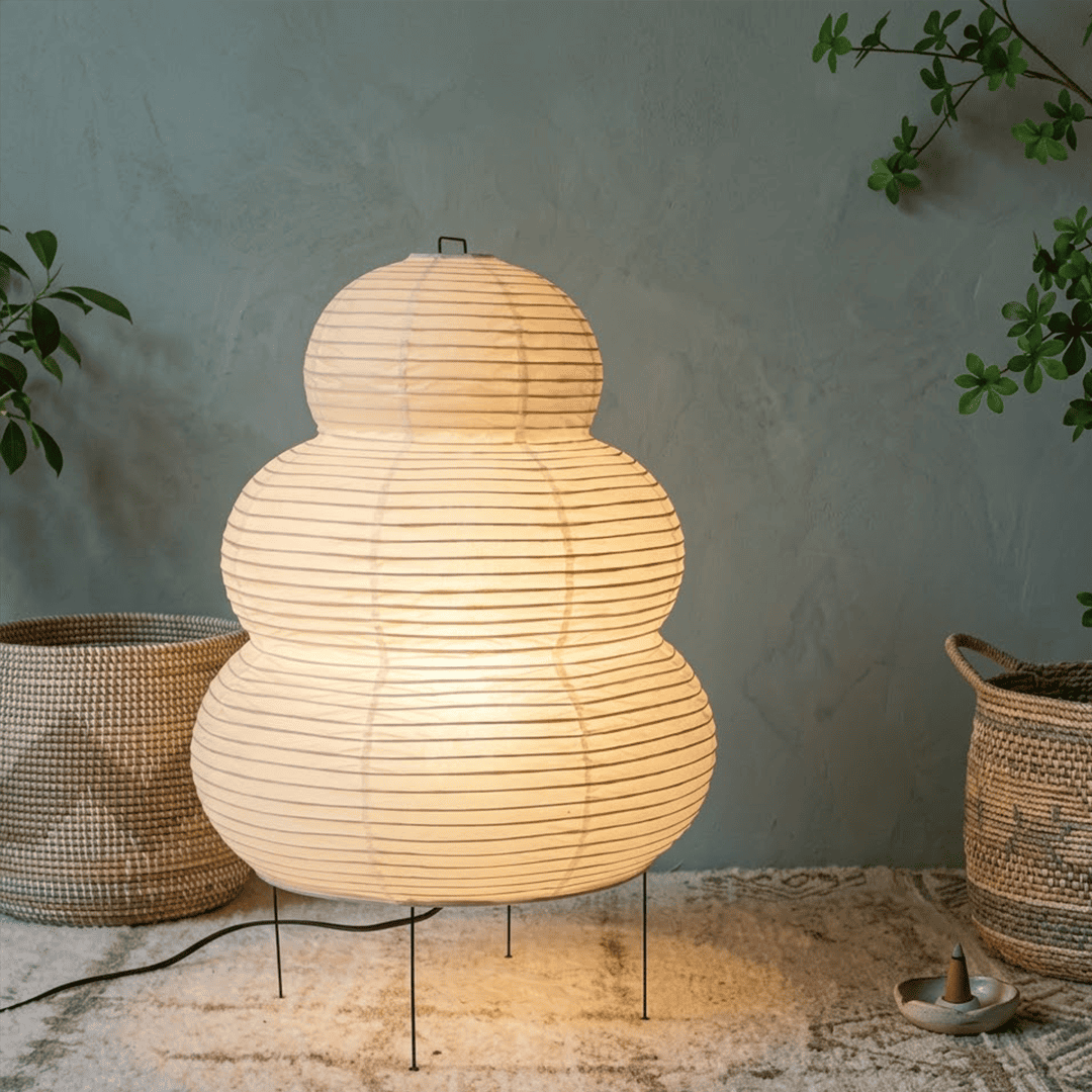 Stuberlighting 25N large Washi paper floor lamp with three-tiered silhouette in a warm minimalist living room setting.