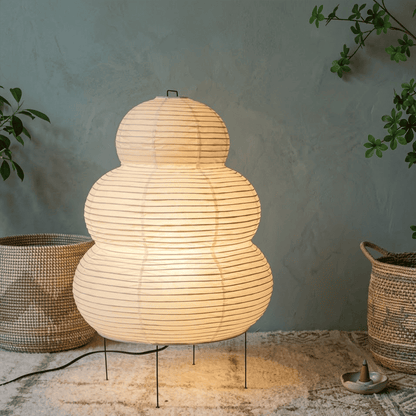 Stuberlighting 25N large Washi paper floor lamp with three-tiered silhouette in a warm minimalist living room setting.