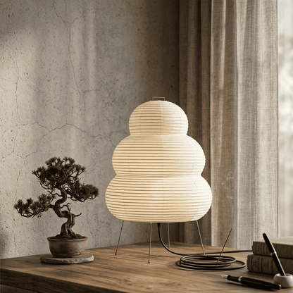 Stuberlighting 25N large Washi paper floor lamp with three-tiered silhouette in a warm minimalist living room setting.