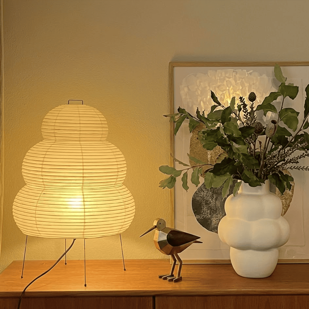 Stuberlighting 25N large Washi paper floor lamp with three-tiered silhouette in a warm minimalist living room setting.