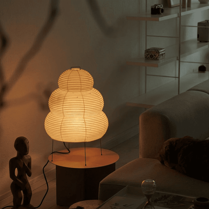 Stuberlighting 25N large Washi paper floor lamp with three-tiered silhouette in a warm minimalist living room setting.