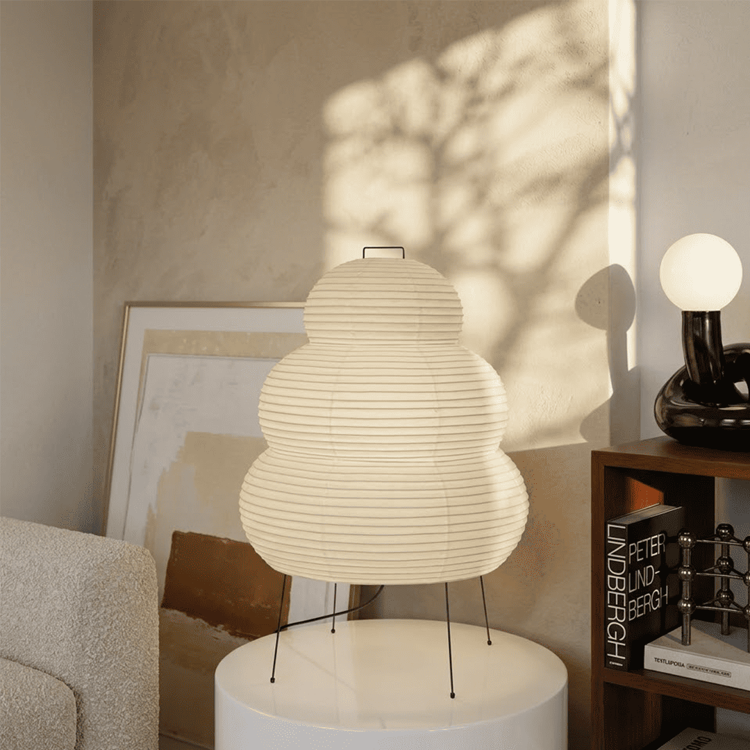 Stuberlighting 25N large Washi paper floor lamp with three-tiered silhouette in a warm minimalist living room setting.
