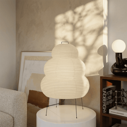 Stuberlighting 25N large Washi paper floor lamp with three-tiered silhouette in a warm minimalist living room setting.