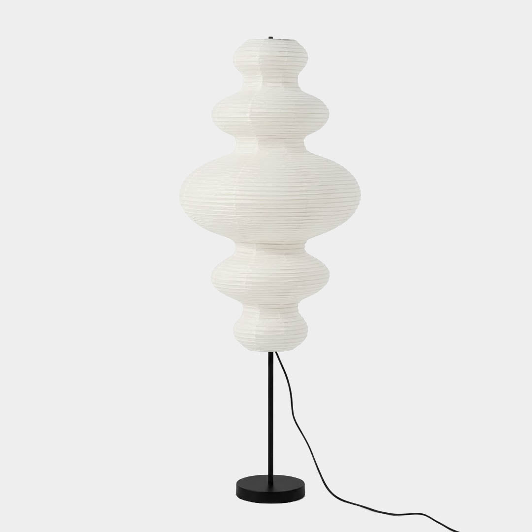 Handcrafted Chigiri Washi paper tower floor lamp with hand-torn mulberry paper texture and matte black base.
