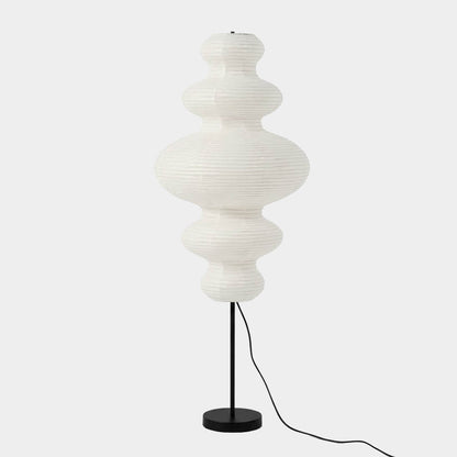 Handcrafted Chigiri Washi paper tower floor lamp with hand-torn mulberry paper texture and matte black base.