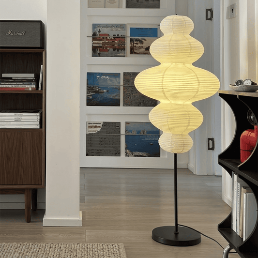 Handcrafted Chigiri Washi paper tower floor lamp with hand-torn mulberry paper texture and matte black base.