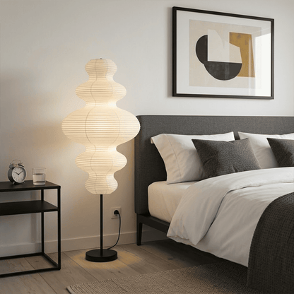 Handcrafted Chigiri Washi paper tower floor lamp with hand-torn mulberry paper texture and matte black base.