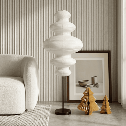 Handcrafted Chigiri Washi paper tower floor lamp with hand-torn mulberry paper texture and matte black base.