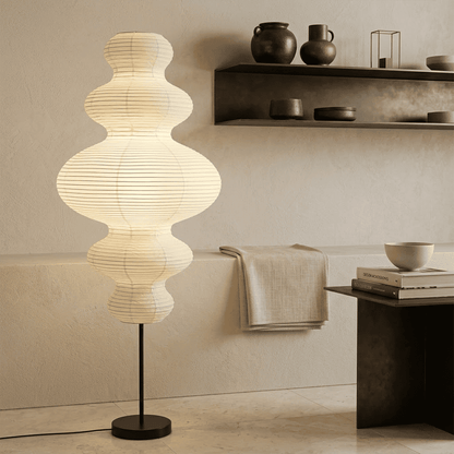 Handcrafted Chigiri Washi paper tower floor lamp with hand-torn mulberry paper texture and matte black base.