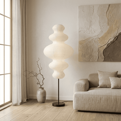 Handcrafted Chigiri Washi paper tower floor lamp with hand-torn mulberry paper texture and matte black base.