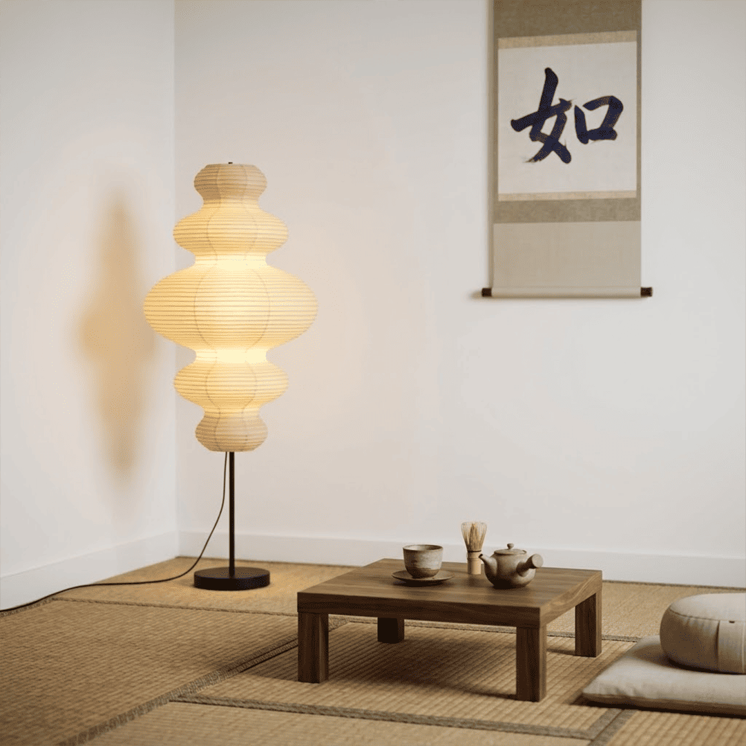Handcrafted Chigiri Washi paper tower floor lamp with hand-torn mulberry paper texture and matte black base.