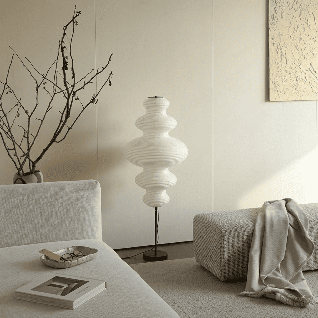 Handcrafted Chigiri Washi paper tower floor lamp with hand-torn mulberry paper texture and matte black base.