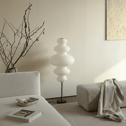 Handcrafted Chigiri Washi paper tower floor lamp with hand-torn mulberry paper texture and matte black base.