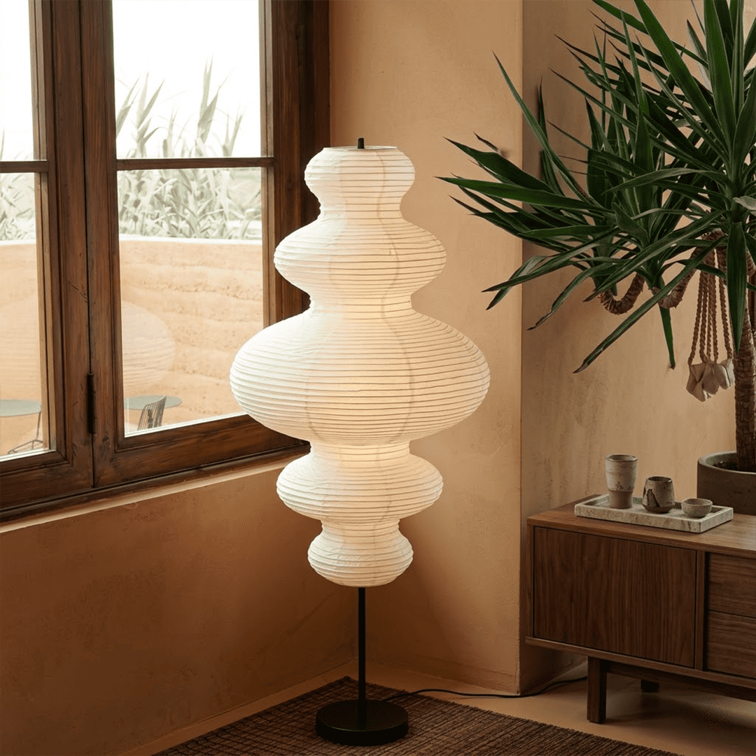 Handcrafted Chigiri Washi paper tower floor lamp with hand-torn mulberry paper texture and matte black base.