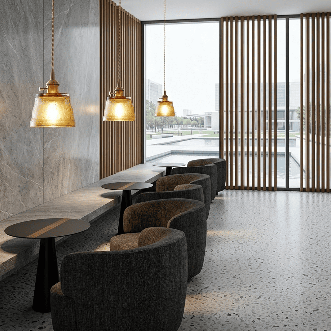 Three amber Nordic Cup pendants above kitchen island marble countertop