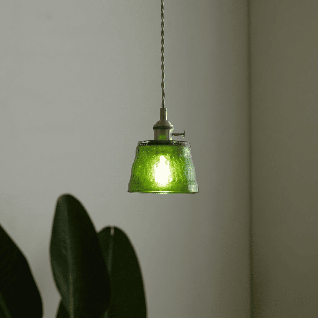 Forest green glass pendant light indoor plants living room warm light