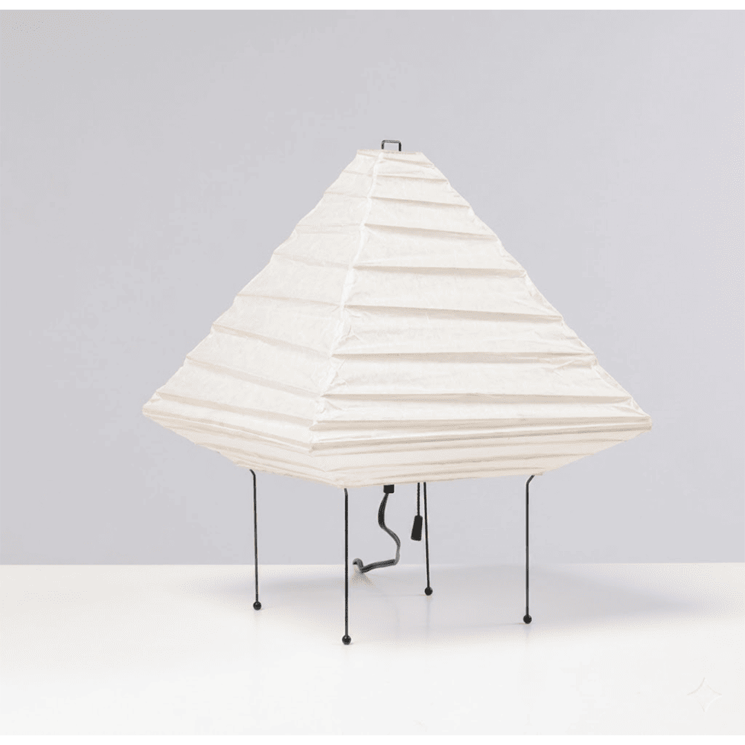 Minimalist modern home lamp: A geometric diamond-shaped washi paper table lamp with a tripod base, emitting a warm glow for cozy interior decoration lighting on a wooden desk.