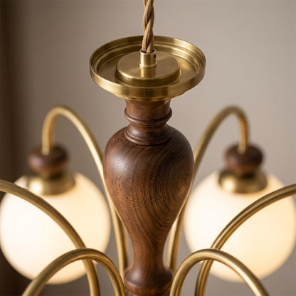 Windsor walnut chandelier  above dining table warm glowing light living room