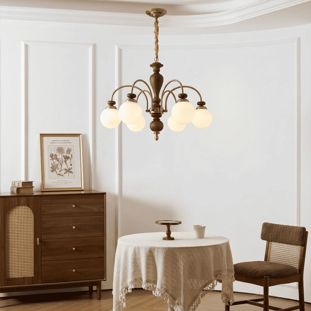 Windsor walnut chandelier  above dining table warm glowing light living room