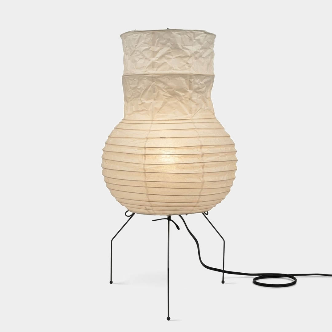 Handcrafted Zara Washi paper table lamp with unique crinkled texture and black tripod base in a Zen interior