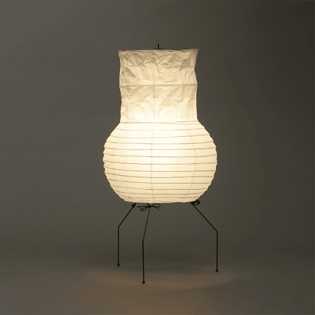 Handcrafted Zara Washi paper table lamp with unique crinkled texture and black tripod base in a Zen interior