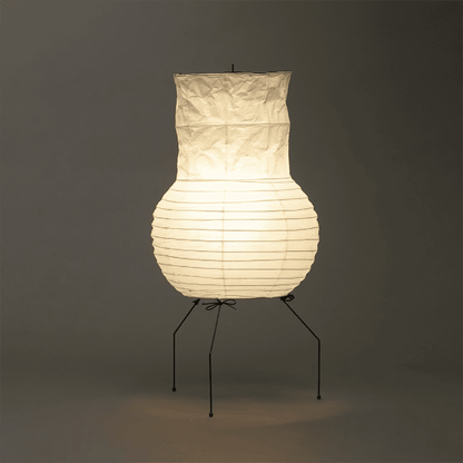 Handcrafted Zara Washi paper table lamp with unique crinkled texture and black tripod base in a Zen interior