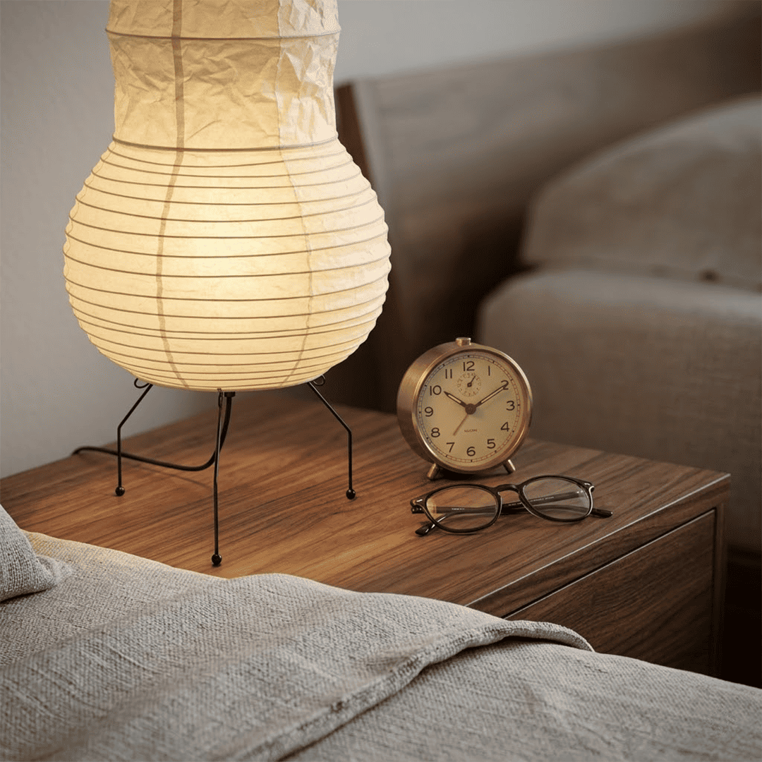 Handcrafted Zara Washi paper table lamp with unique crinkled texture and black tripod base in a Zen interior