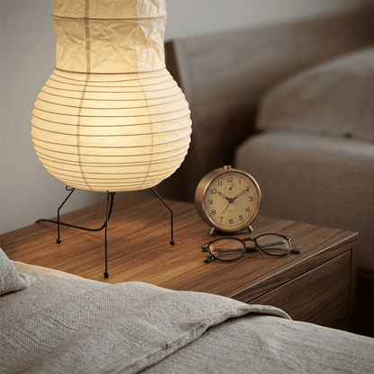 Handcrafted Zara Washi paper table lamp with unique crinkled texture and black tripod base in a Zen interior