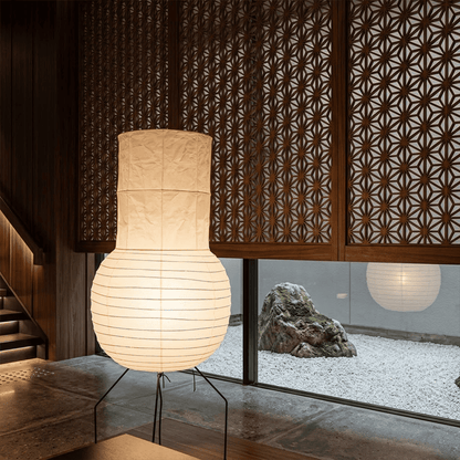 Handcrafted Zara Washi paper table lamp with unique crinkled texture and black tripod base in a Zen interior