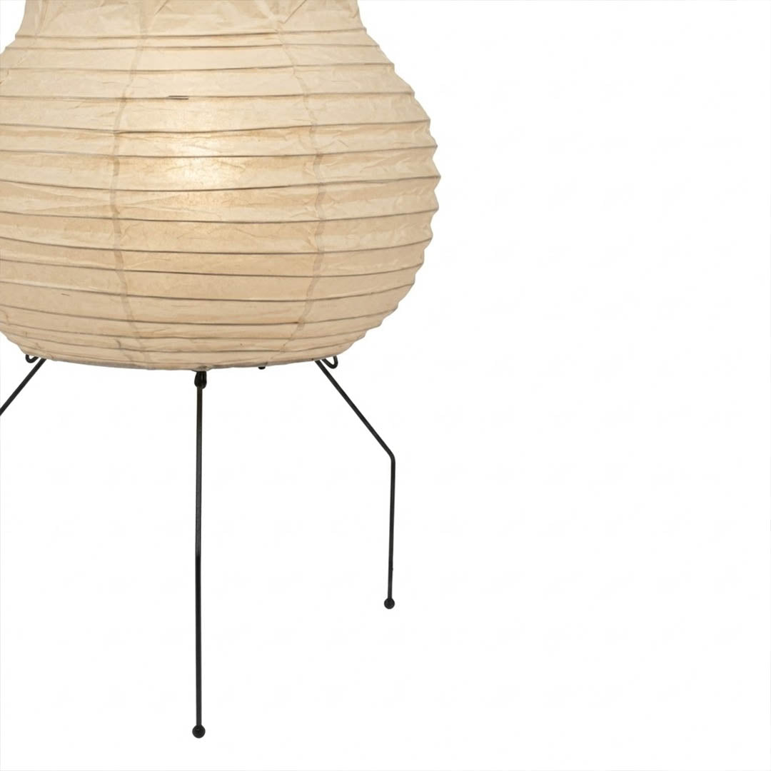 Handcrafted Zara Washi paper table lamp with unique crinkled texture and black tripod base in a Zen interior