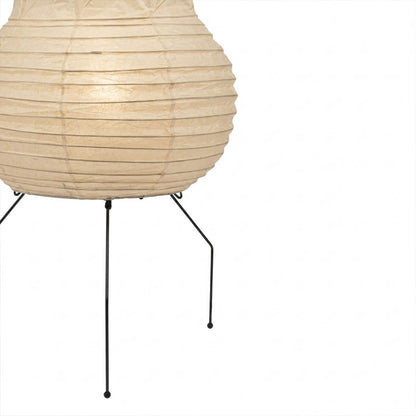 Handcrafted Zara Washi paper table lamp with unique crinkled texture and black tripod base in a Zen interior