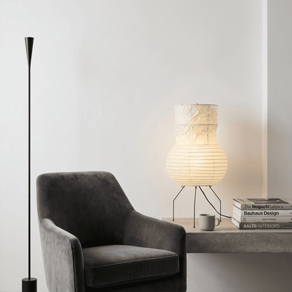 Handcrafted Zara Washi paper table lamp with unique crinkled texture and black tripod base in a Zen interior