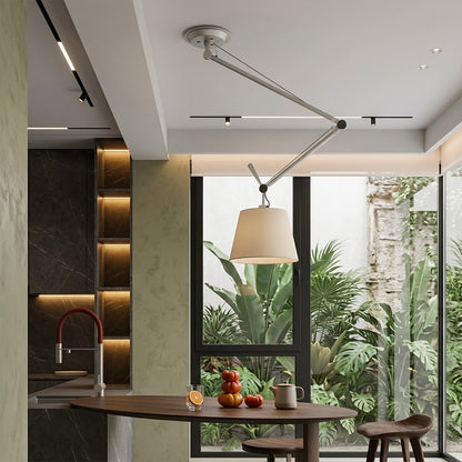 Tate industrial chandelier loft apartment dining table exposed brick walls aluminum frame parchment warm interior