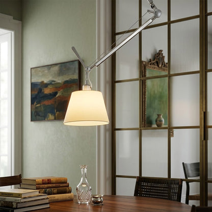 Tate industrial chandelier above home office desk warm parchment glow concrete walls modern minimalist workspace