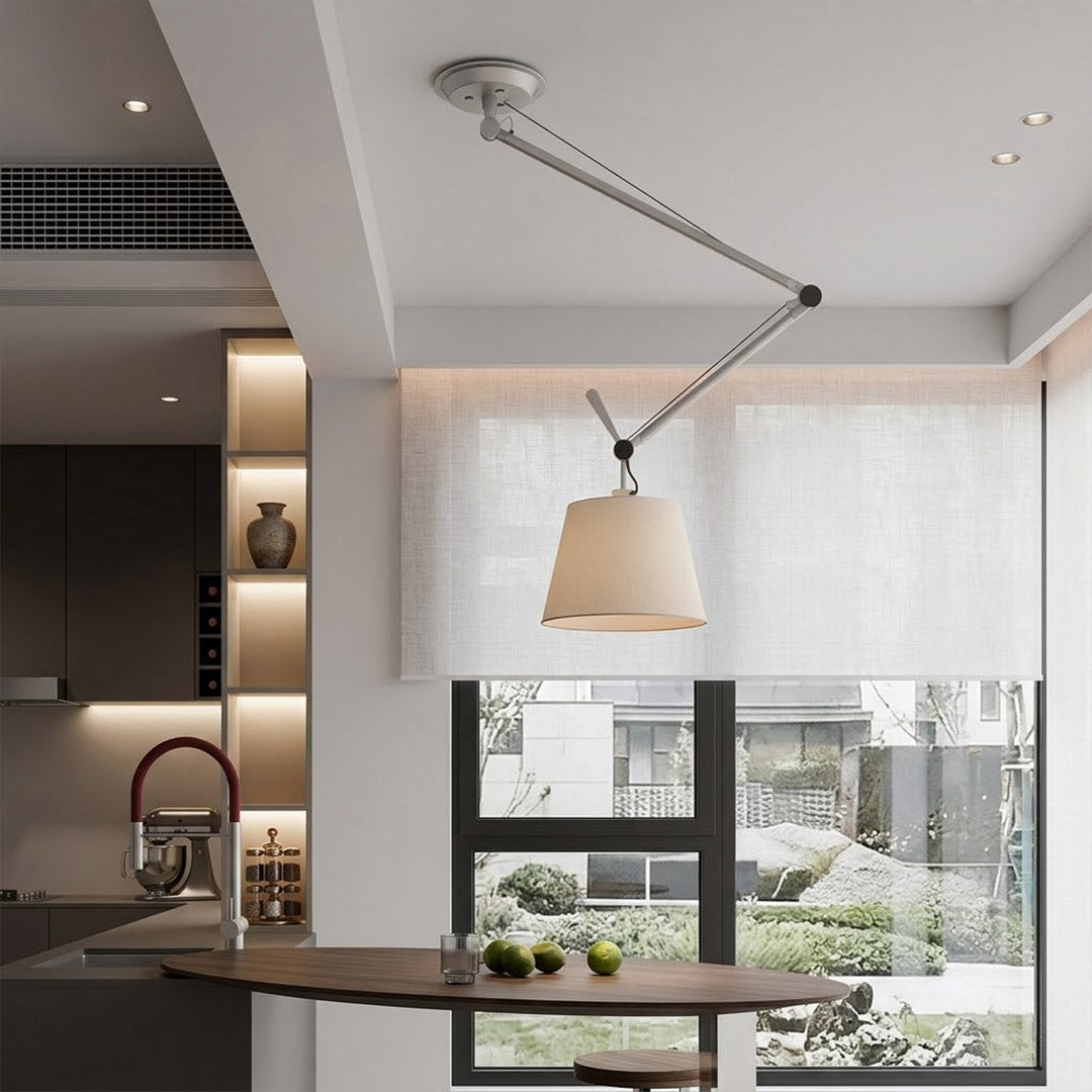 Tate industrial chandelier loft apartment dining table exposed brick walls aluminum frame parchment warm interior