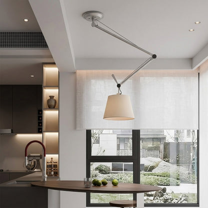 Tate industrial chandelier loft apartment dining table exposed brick walls aluminum frame parchment warm interior
