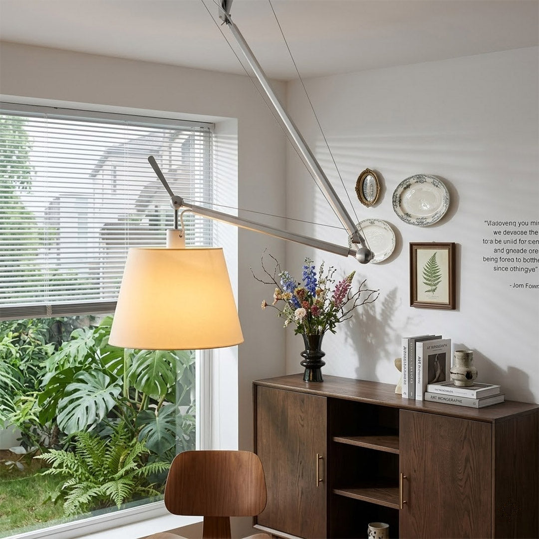 Tate industrial chandelier above home office desk warm parchment glow concrete walls modern minimalist workspace