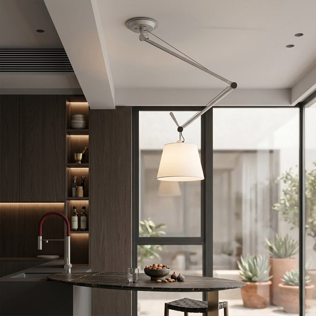 Tate industrial chandelier loft apartment dining table exposed brick walls aluminum frame parchment warm interior
