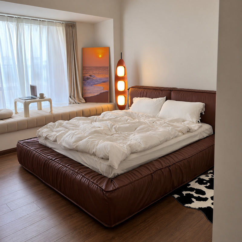 Tavola wood floor lamp adding a warm mid-century accent beside a modern master bedroom bed