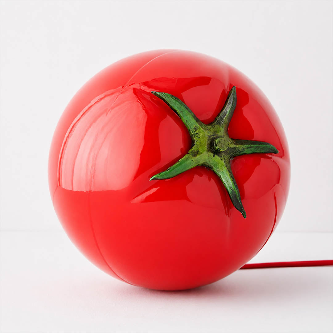 Tomato glass table lamp glossy glass finish smooth shine red surface detail close up premium