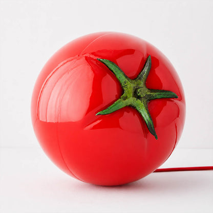 Tomato glass table lamp glossy glass finish smooth shine red surface detail close up premium