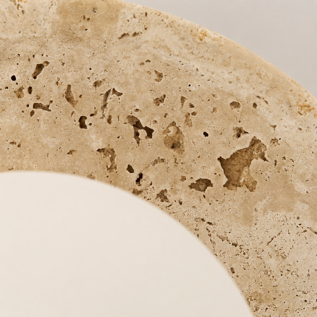Tondo travertine ceiling light yellow travertine natural stone veining porous texture detail close up unique