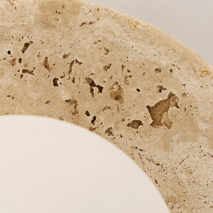 Tondo travertine ceiling light yellow travertine natural stone veining porous texture detail close up unique