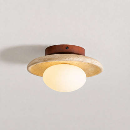 Tondo travertine ceiling light illuminated warm moonlit ambient glow travertine stone glass diffuser white background