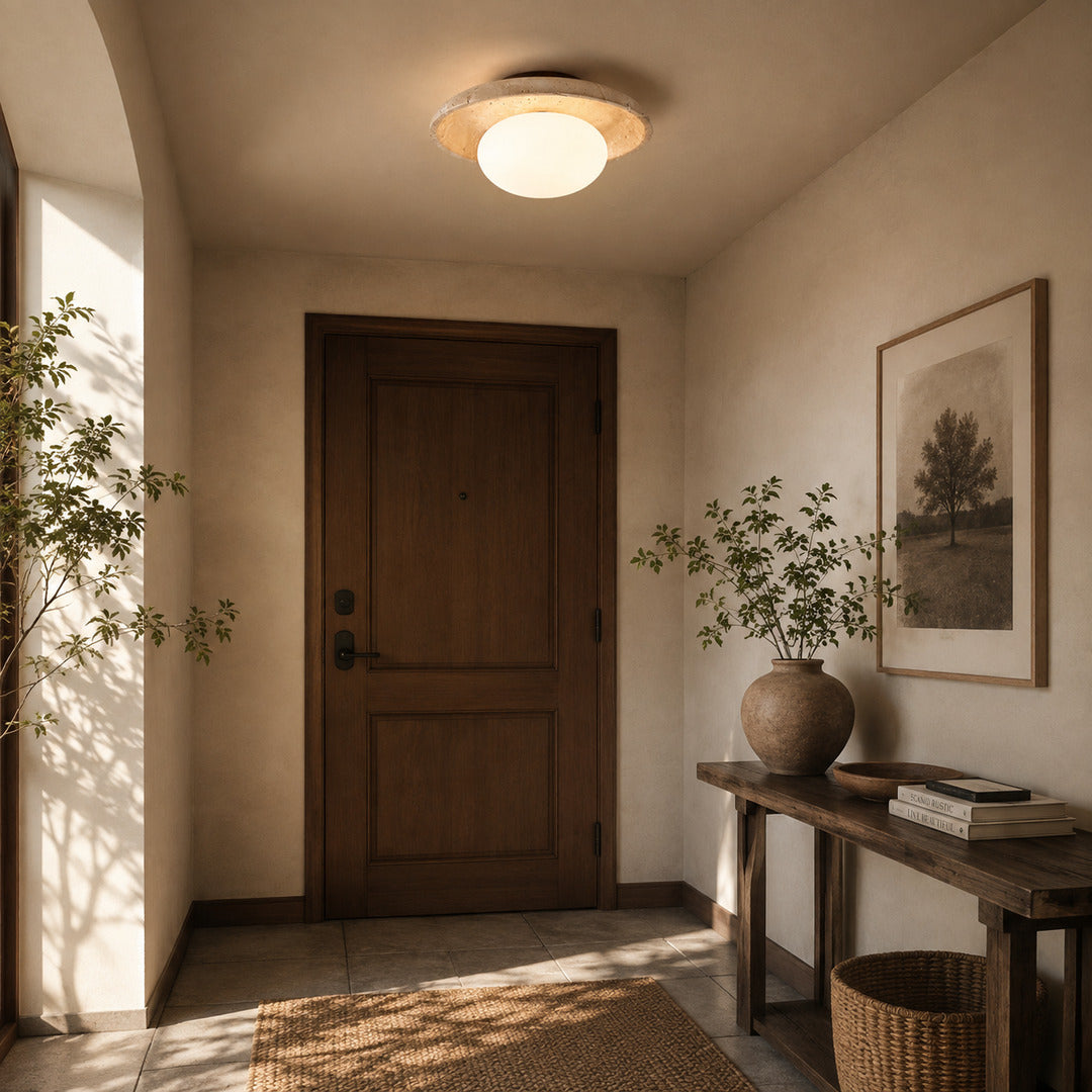 Tondo travertine ceiling light entryway foyer warm glow travertine stone glass flush mount American home lifestyle interior styled