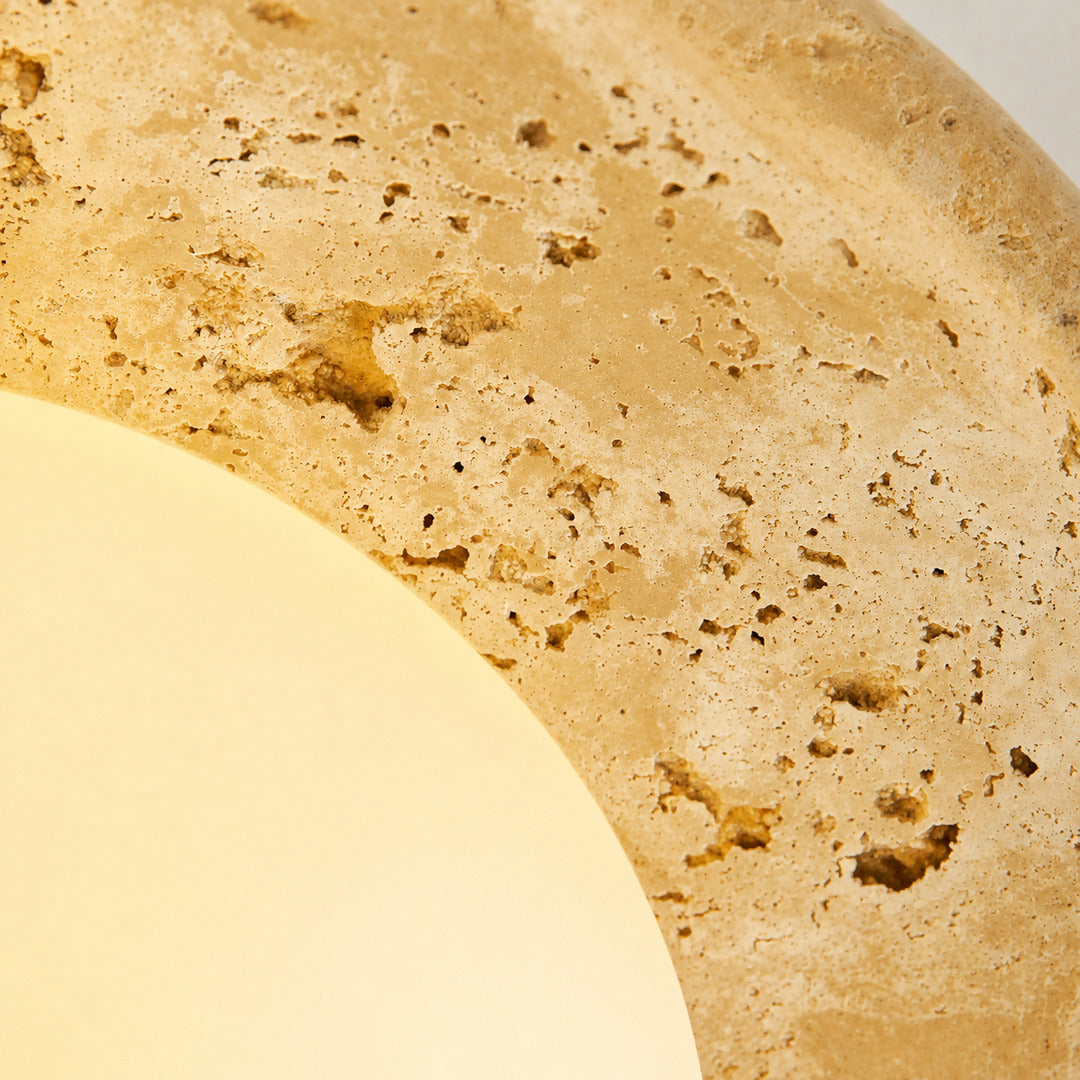 Tondo travertine ceiling light yellow travertine natural stone veining porous texture detail close up unique