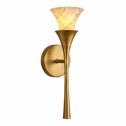 Torcia alabaster wall sconce with a torch-style flared natural stone shade glowing warm on a wall