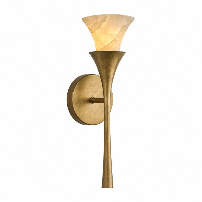 Brushed brass Torcia alabaster wall sconce as a warm torch-style accent beside a bed