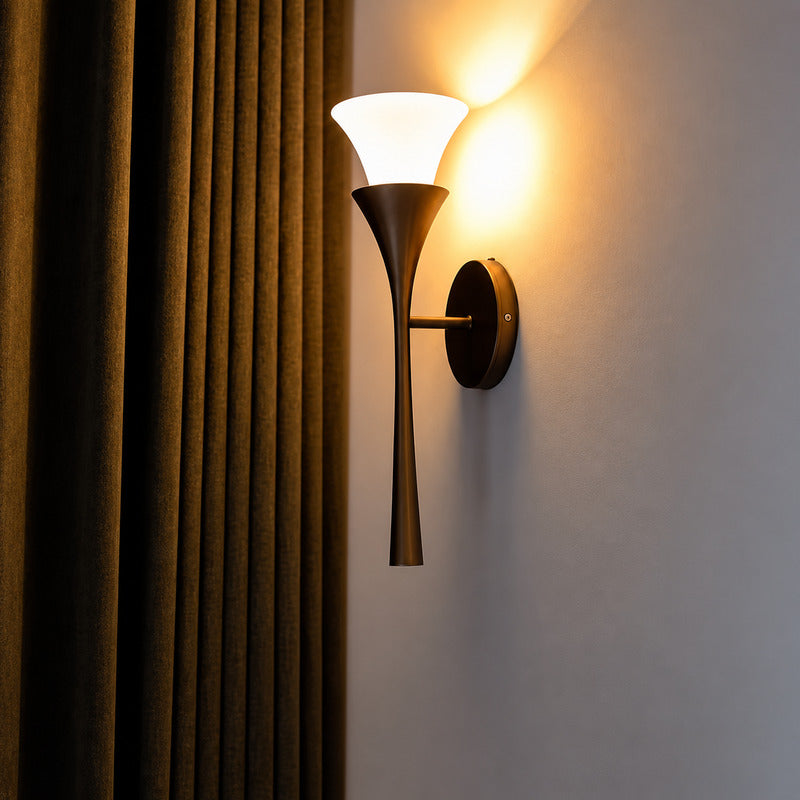 Close-up of the upward-flared natural alabaster shade on the Torcia wall sconce like a torch flame