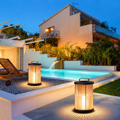 Torre outdoor garden lights lining a boutique hotel garden and poolside at dusk